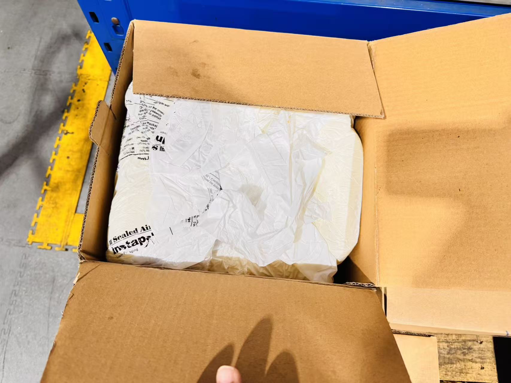 Open export packing box inspection showing inner packaging check before dispatch for industrial bearing shipment