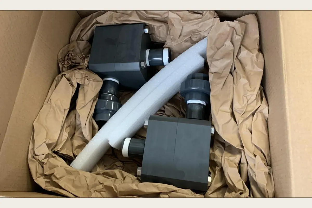 De Nora water process components in export packing for pumps, water treatment and process equipment, team-handled supply reference